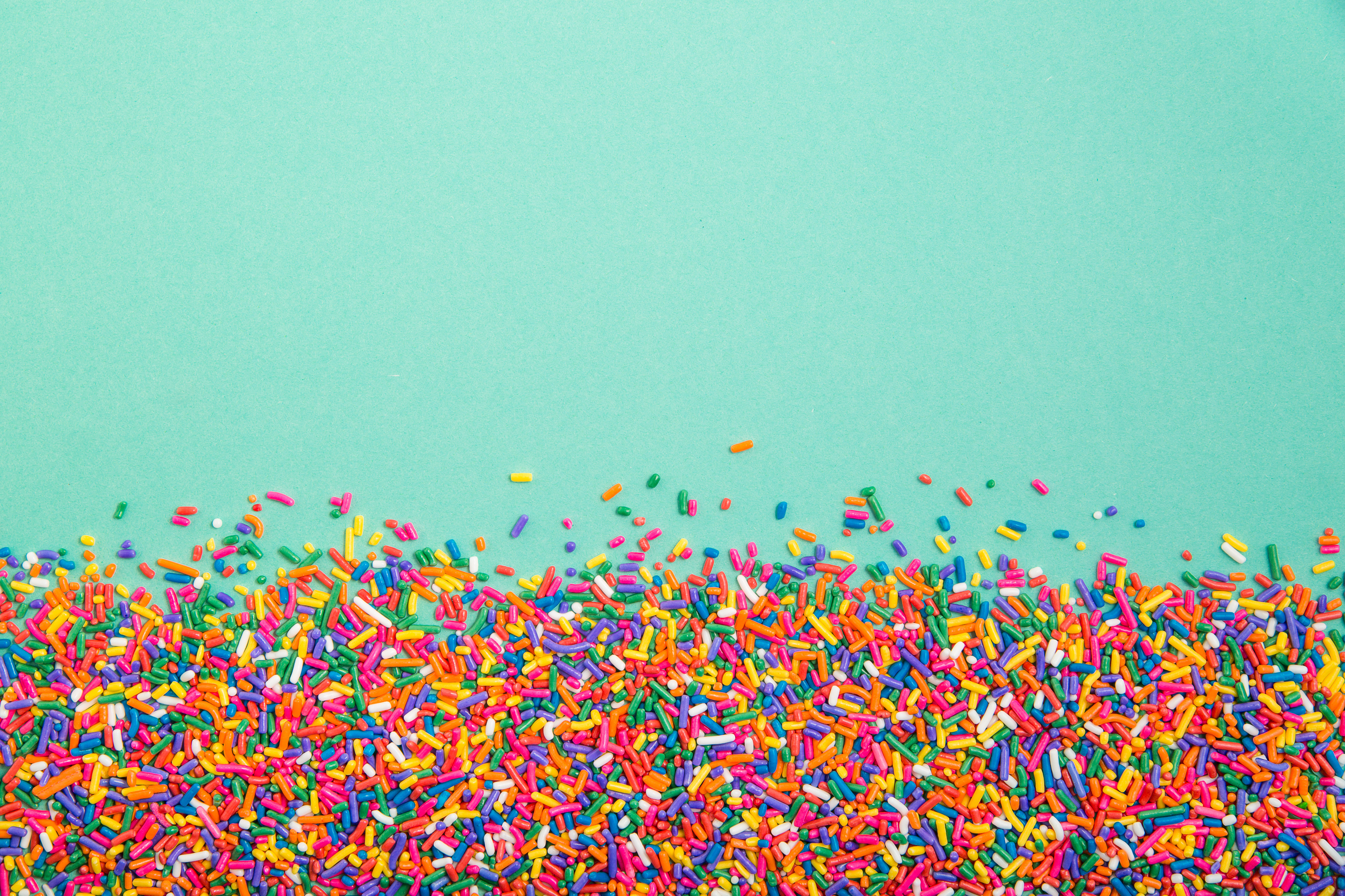 Colorful Sprinkles on Green Background